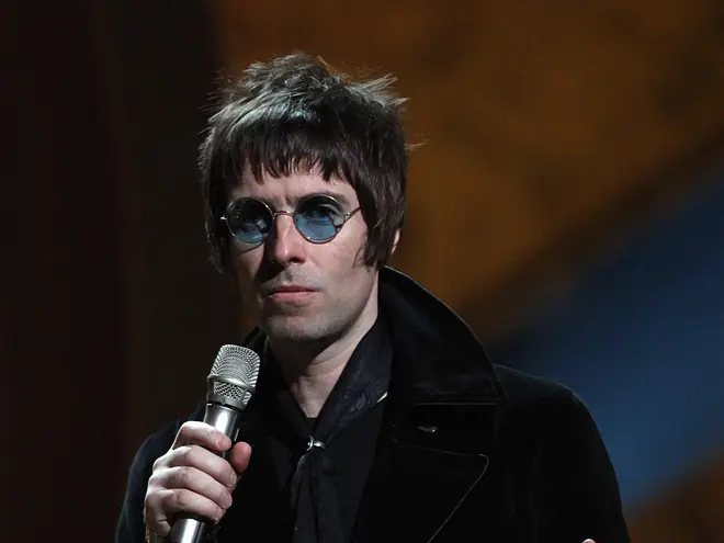 Liam Gallagher on stage to collect the award for BRITs Album Of 30 Years won by Oasis during the BRIT Awards 2010