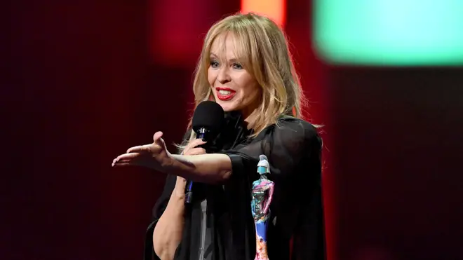 Kylie Minogue accepts the BRITs Global Icon award