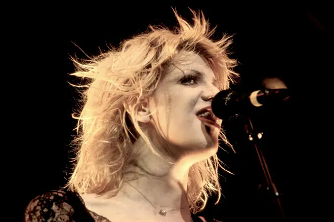 Courtney Love, performing with Hole