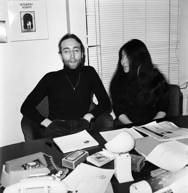 Beatles singer John Lennon with wife Yoko Ono at Apple headquarters as he sends his MBE back to The Queen.