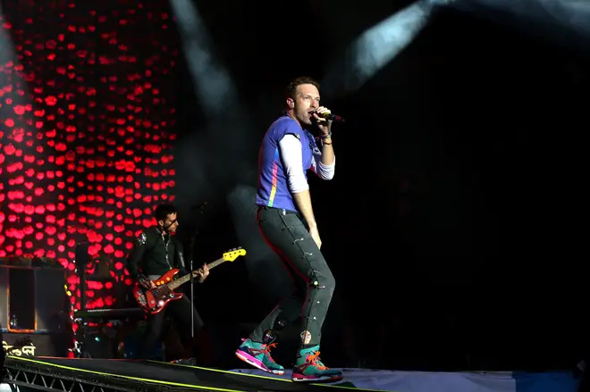 Chris Martin of Coldplay performing at Glastonbury 2016.