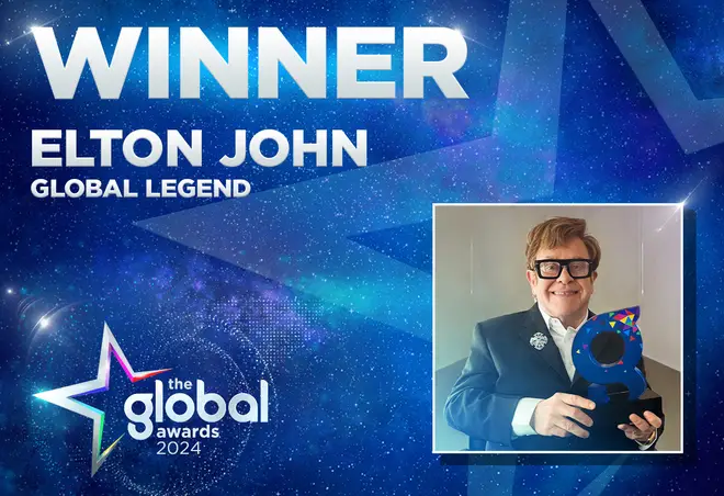 Elton John holds his Global Legend award for 2024