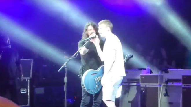 Foo Fighters' Dave Grohl invites fan up on stage in Houston