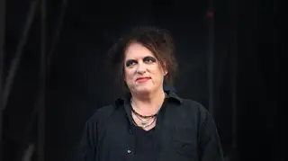 Robert Smith of The Cure poses backstage before performing at Bellahouston Park on August 16, 2019 in Glasgow