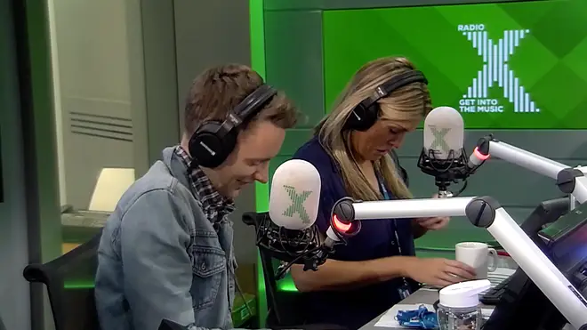 Pippa checks her popped button on her shirt during boob chat on The Chris Moyles Show