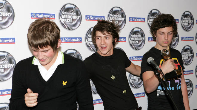 Jamie Cook, Alex Turner and Matt Helders pose backstage with the Nationwide Mercury Prize winners' award