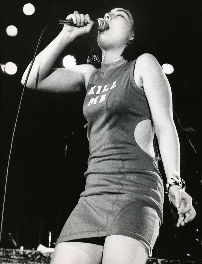 Singer Kathleen Hanna of the punk group Bikini Kill onstage in 1993