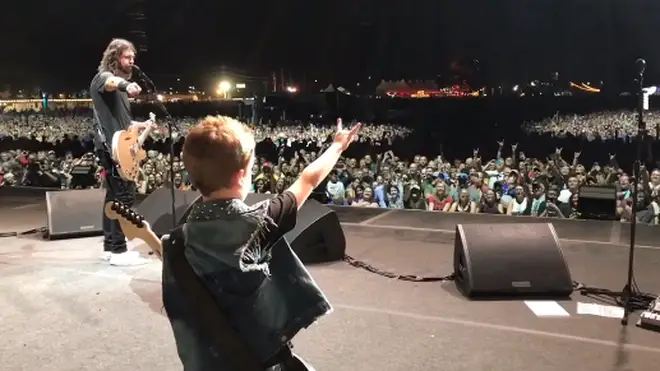 Foo Fighters' Dave Grohl welcomes the eight-year-old son of Anthrax guitarist Scott Ian on stage to play Everlong
