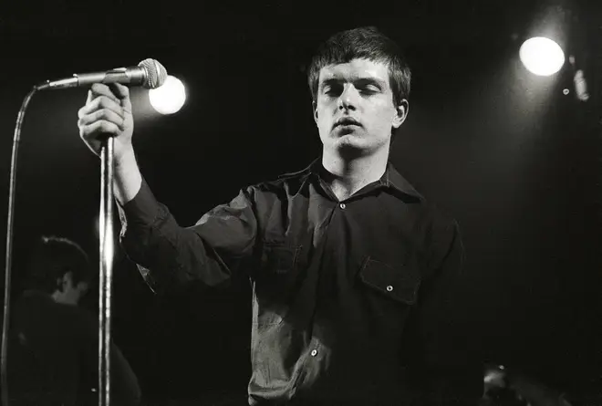 Ian Curtis of Joy Division performing live in 1980