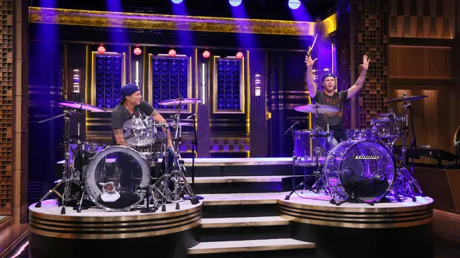 Drummer Chad Smith competes in a drum-off with actor Will Ferrell on May 22, 2014