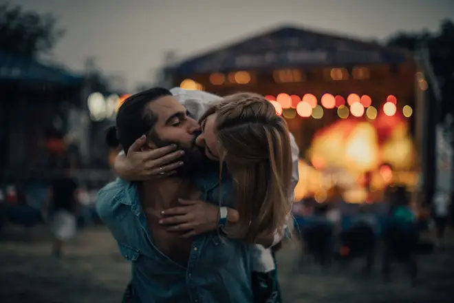 Stock image of festival couple kissing