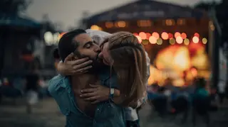 Stock image of festival couple kissing