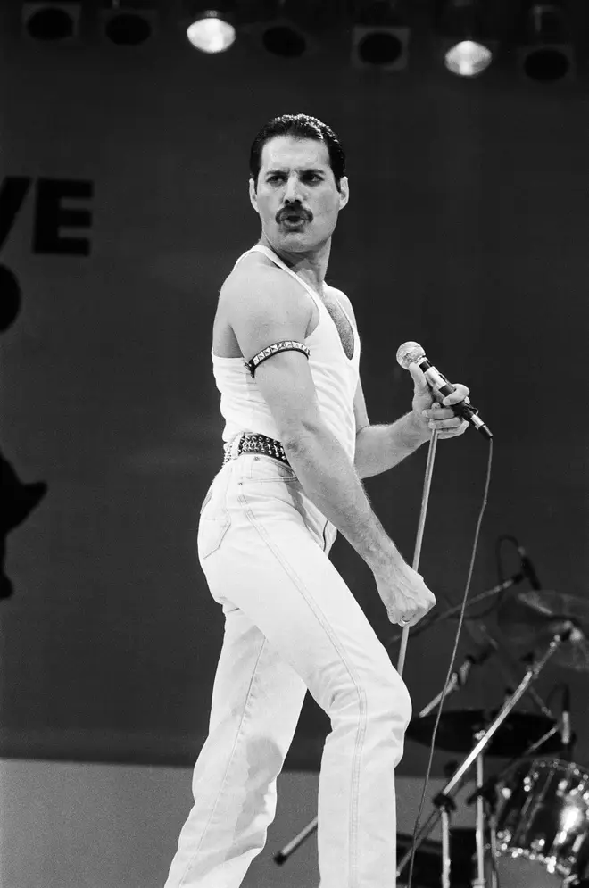 Freddie Mercury performing on stage at Wembley Stadium during Live Aid 13th July 1985