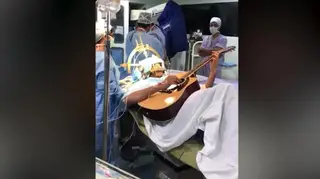 Musician plays guitar during brain surgery