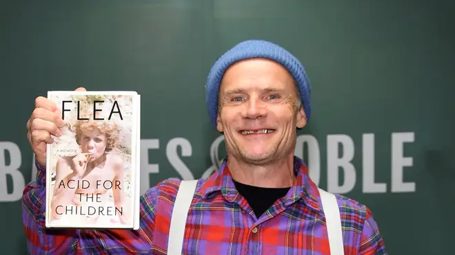 Red Hot Chili Peppers' Flea signs copies of his new book Acid For The Children