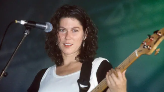 Kim Deal performs with the Pixies at Reading Festival in 1990