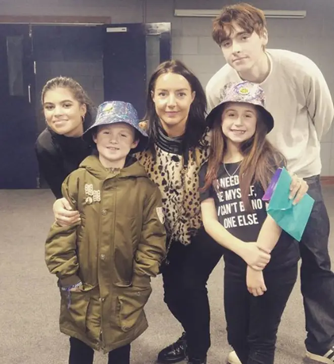 Liam Gallagher's daughter Molly Moorish, son Gene and Debbie Gwyther pose with young Luca and his sister Eva